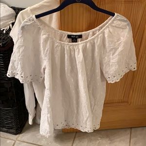 Adorable top with eyelet sleeves and white dots